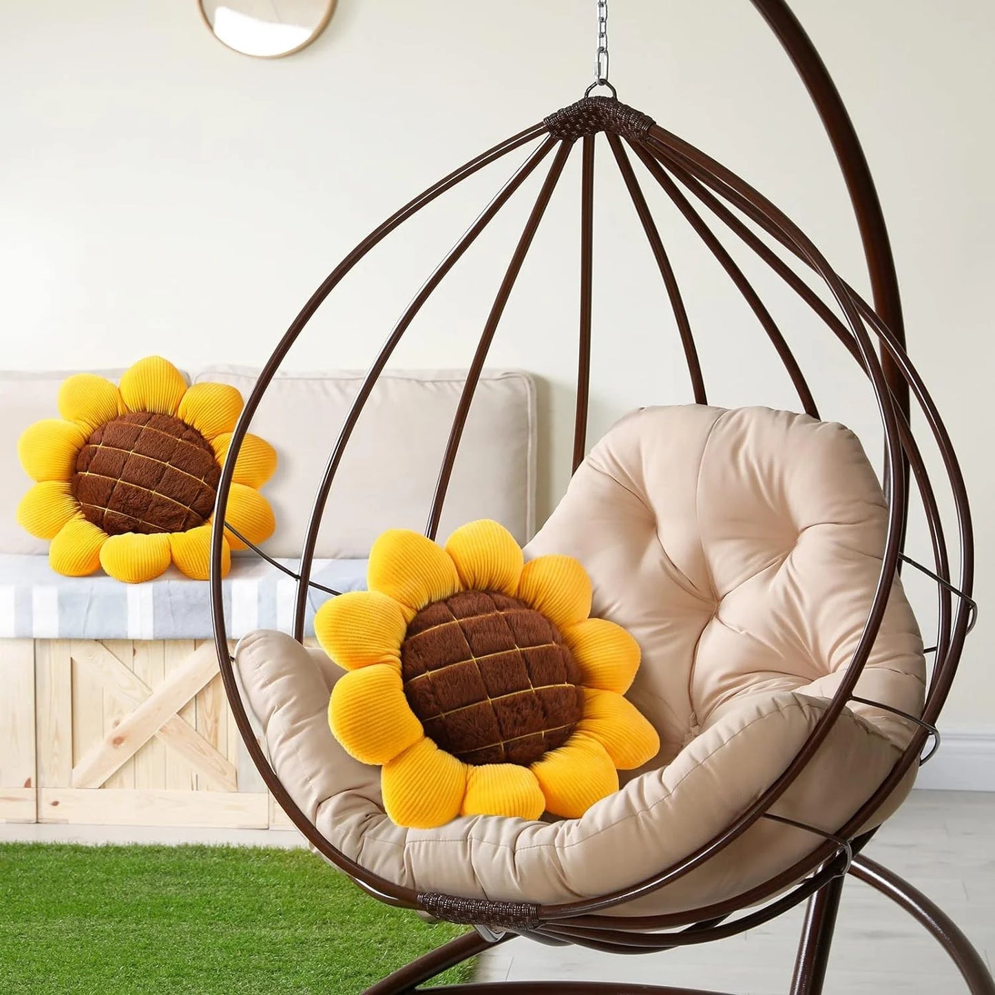 Soft sunflower throw pillow with plush yellow petals and brown quilted center on chair&nbsp;