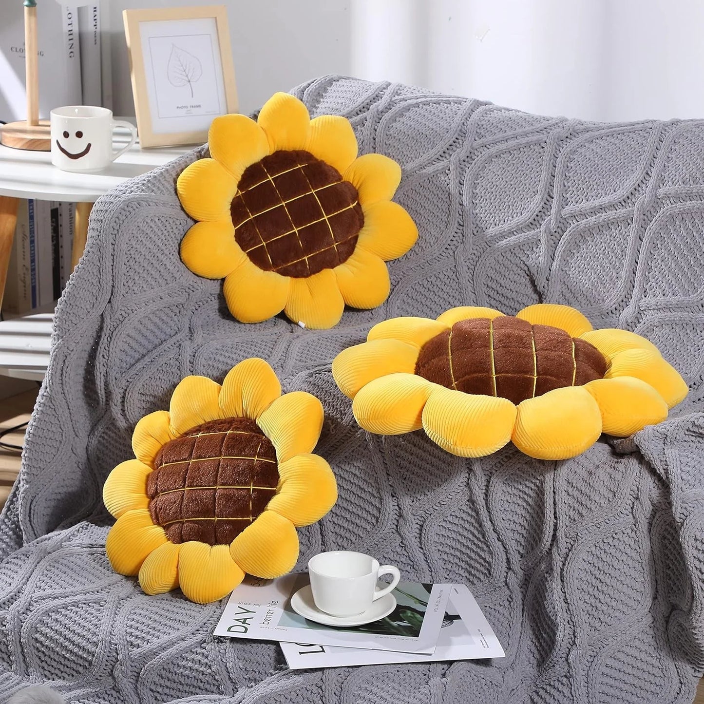 Soft sunflower throw pillow with plush yellow petals and brown quilted center on chair&nbsp;